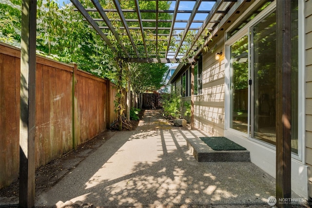 18130 Sunrise Ridge Ave NE, Poulsbo, WA 98370 - fenced backyard featuring a pergola and a patio area