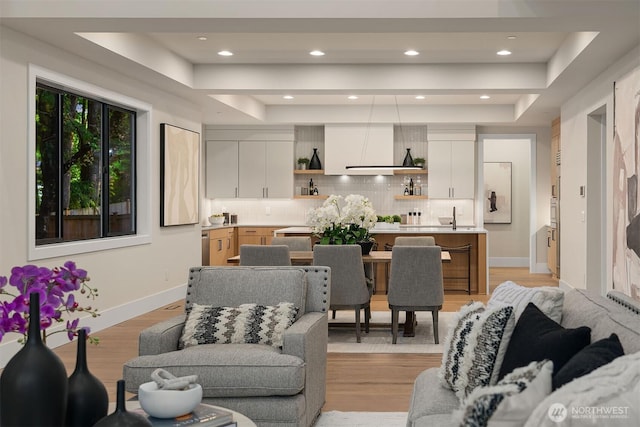 1704 172nd Ct NE, Bellevue, WA 98008 - living area with a raised ceiling, light wood-style floors, and recessed lighting