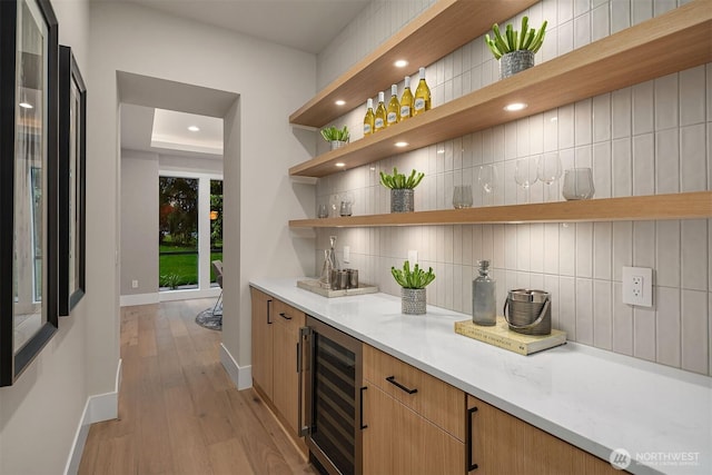 1704 172nd Ct NE, Bellevue, WA 98008 - indoor dry bar featuring beverage cooler, decorative backsplash, light wood-style floors, and recessed lighting