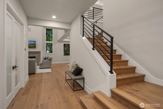 1704 172nd Ct NE, Bellevue, WA 98008 - stairs featuring a fireplace, wood finished floors, and recessed lighting