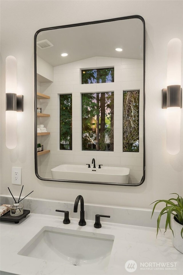1704 172nd Ct NE, Bellevue, WA 98008 - bathroom with vanity and a freestanding tub