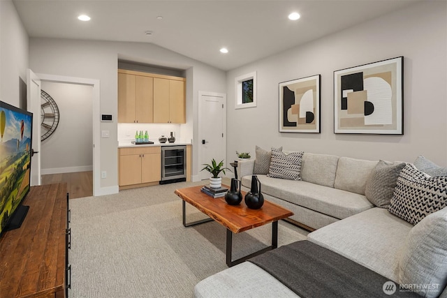 1704 172nd Ct NE, Bellevue, WA 98008 - living room featuring beverage cooler, lofted ceiling, bar with sink, recessed lighting, and light wood finished floors