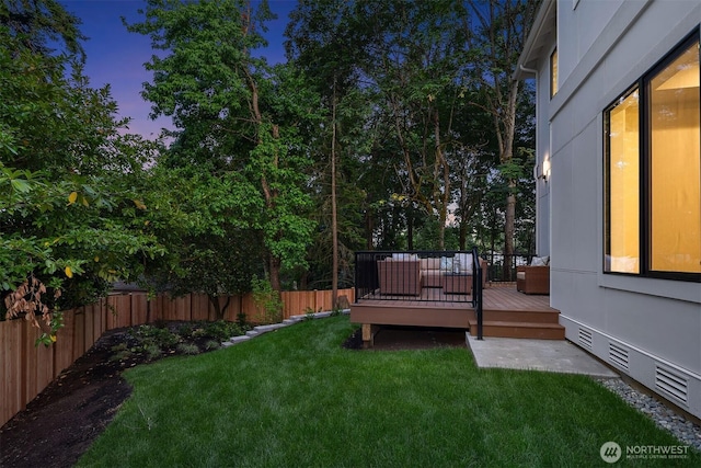 1704 172nd Ct NE, Bellevue, WA 98008 - yard at dusk with a fenced backyard and a deck