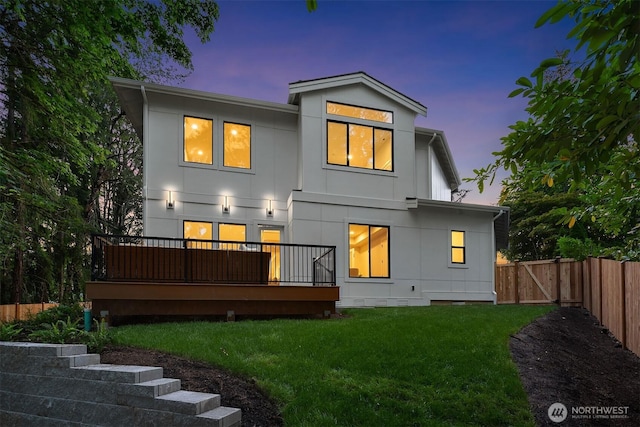 1704 172nd Ct NE, Bellevue, WA 98008 - back of property featuring a fenced backyard, stucco siding, and a deck
