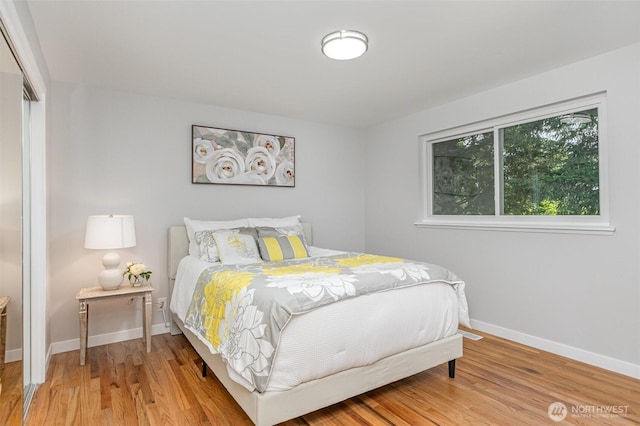 14249 NE 1st St, Bellevue, WA 98007 - bedroom featuring wood finished floors and a closet