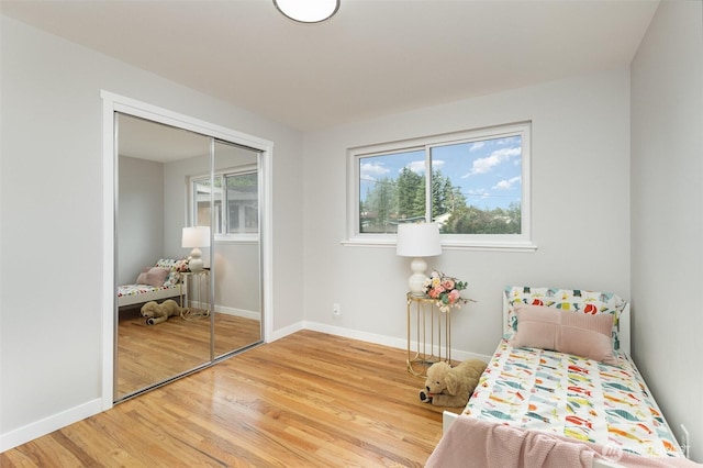 14249 NE 1st St, Bellevue, WA 98007 - bedroom featuring wood finished floors and a closet