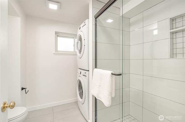 14249 NE 1st St, Bellevue, WA 98007 - laundry room featuring stacked washer and clothes dryer and light tile patterned floors