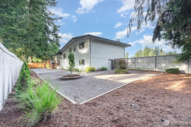 14249 NE 1st St, Bellevue, WA 98007 - rear view of property with a fenced backyard and a patio area