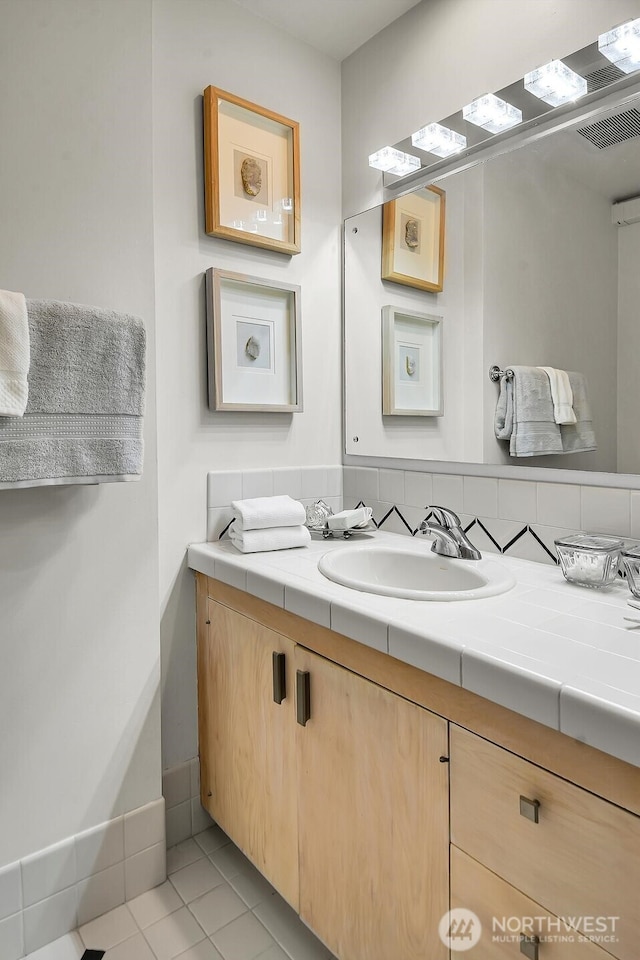 500 W Olympic Pl Unit 401, Seattle, WA 98119 - bathroom with vanity and tile patterned flooring