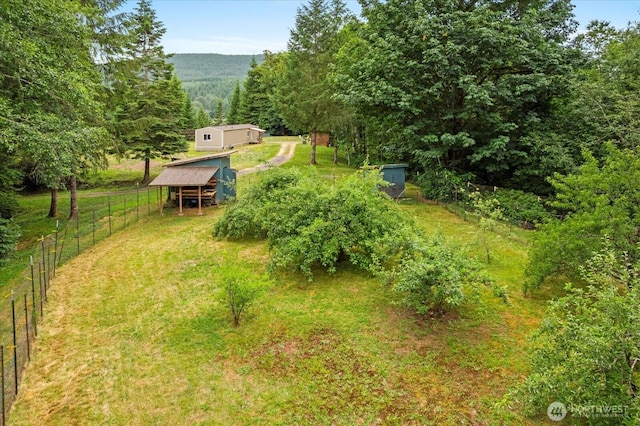 18025 Cedar Ponds Rd, Monroe, WA 98272 - view of yard featuring an outdoor structure and a forest view