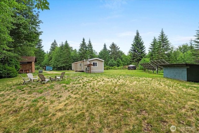 18025 Cedar Ponds Rd, Monroe, WA 98272 - view of grassy yard featuring a storage unit