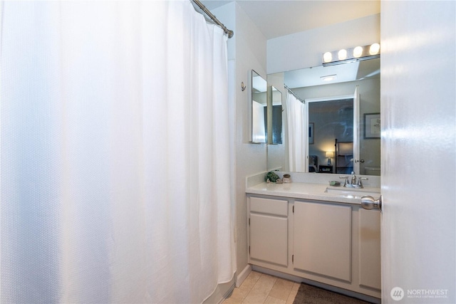 4231 NE 5th St Unit C102, Renton, WA 98059 - bathroom with vanity and a shower with curtain