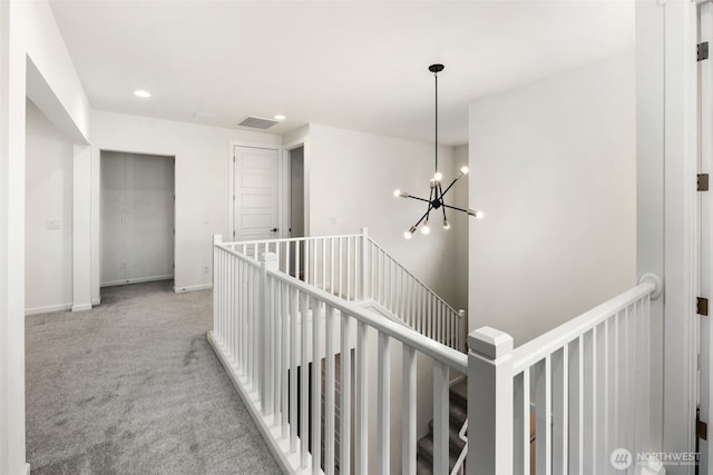 12619 176th St E, Puyallup, WA 98374 - corridor with an upstairs landing, a chandelier, carpet, and recessed lighting
