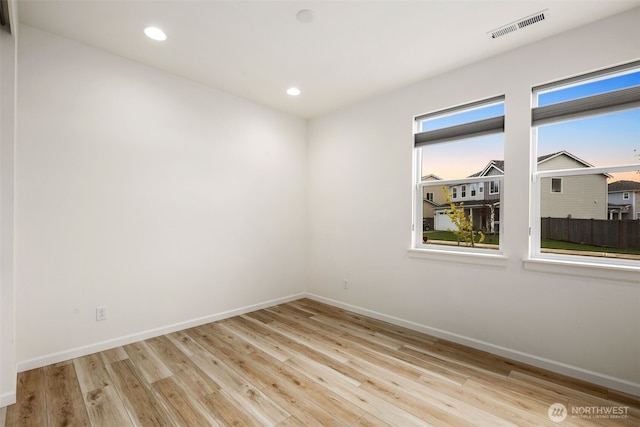 12619 176th St E, Puyallup, WA 98374 - spare room featuring wood finished floors and recessed lighting