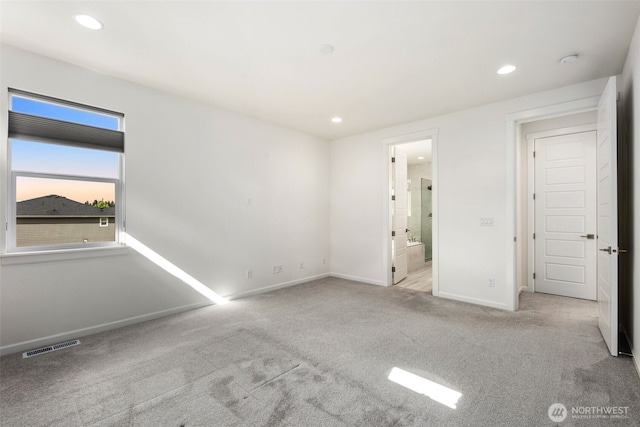 12619 176th St E, Puyallup, WA 98374 - unfurnished bedroom featuring carpet floors, recessed lighting, and ensuite bathroom