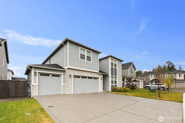 12619 176th St E, Puyallup, WA 98374 - traditional-style house featuring stone siding, concrete driveway, a garage, and a residential view
