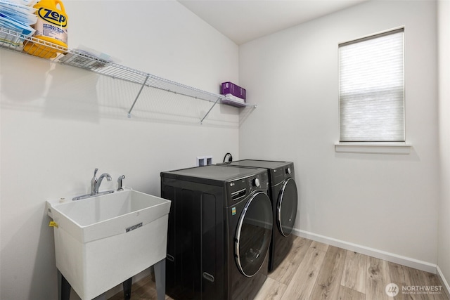 12619 176th St E, Puyallup, WA 98374 - laundry area with washing machine and clothes dryer and light wood finished floors