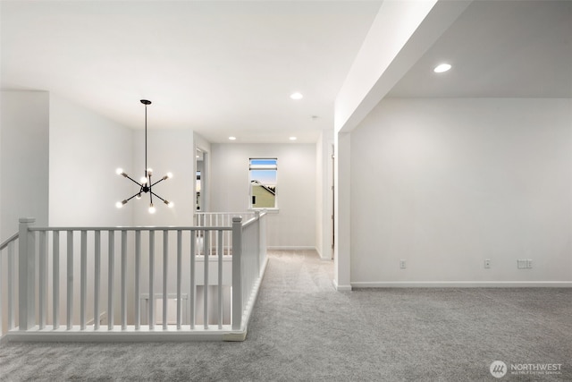 12619 176th St E, Puyallup, WA 98374 - hallway with an upstairs landing, a chandelier, carpet floors, and recessed lighting