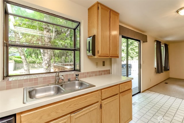 16410 92nd Ave E, Puyallup, WA 98375 - kitchen featuring light countertops, backsplash, and light brown cabinetry