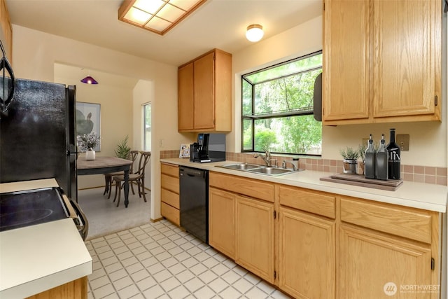 16410 92nd Ave E, Puyallup, WA 98375 - kitchen featuring black appliances, light brown cabinetry, and light countertops