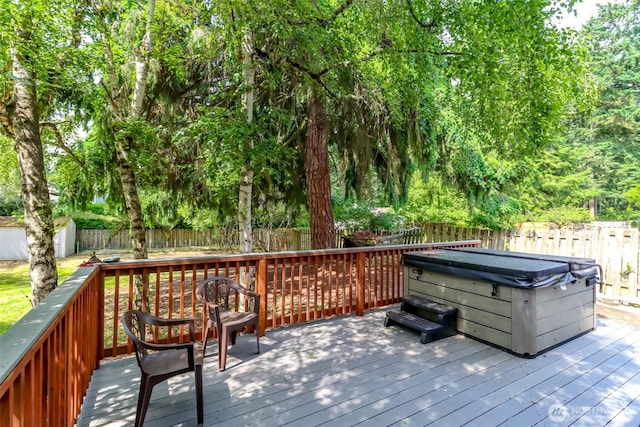 16410 92nd Ave E, Puyallup, WA 98375 - wooden deck featuring a hot tub, a fenced backyard, and a shed