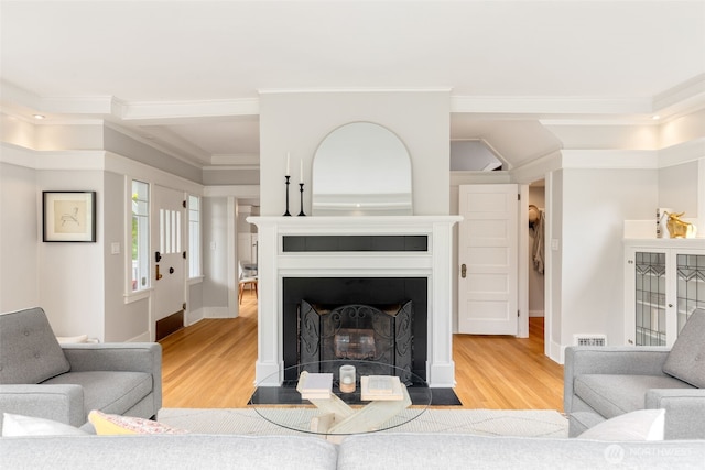 2823 34th Ave S, Seattle, WA 98144 - living room featuring wood finished floors, crown molding, and a fireplace with flush hearth