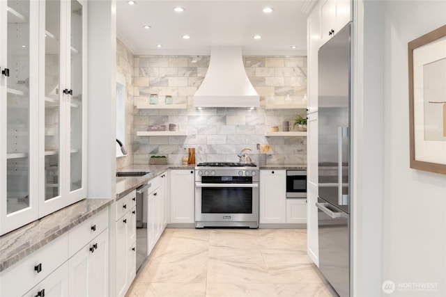 2823 34th Ave S, Seattle, WA 98144 - kitchen featuring built in appliances, custom range hood, open shelves, recessed lighting, and light stone countertops