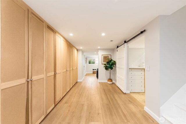 2823 34th Ave S, Seattle, WA 98144 - hall with recessed lighting, a barn door, and light wood-style flooring