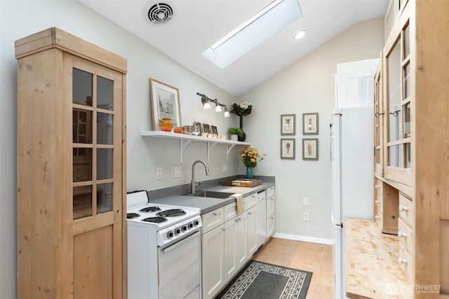 2823 34th Ave S, Seattle, WA 98144 - kitchen featuring white appliances, a skylight, lofted ceiling, white cabinetry, and open shelves