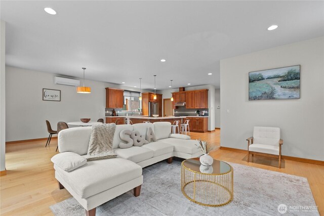 3800 SW Holden St, Seattle, WA 98126 - living room featuring an AC wall unit, recessed lighting, and light wood finished floors