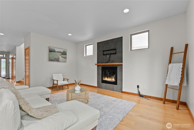 3800 SW Holden St, Seattle, WA 98126 - living area featuring a tiled fireplace, light wood-style floors, and recessed lighting
