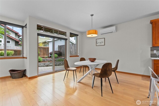 3800 SW Holden St, Seattle, WA 98126 - dining space with a wall mounted air conditioner and light wood-style flooring