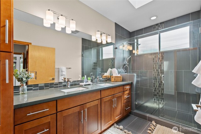 3800 SW Holden St, Seattle, WA 98126 - bathroom with double vanity, a shower stall, and tile patterned flooring