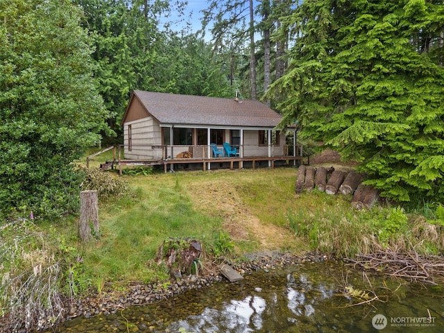 2120 E Spencer Lake Rd, Shelton, WA 98584 - back of house with a wooden deck and a lawn