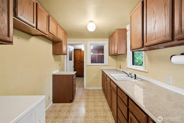 2120 E Spencer Lake Rd, Shelton, WA 98584 - kitchen featuring light floors, light countertops, and brown cabinets