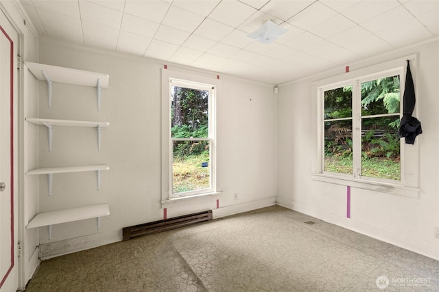2120 E Spencer Lake Rd, Shelton, WA 98584 - empty room with a baseboard radiator and tile patterned floors