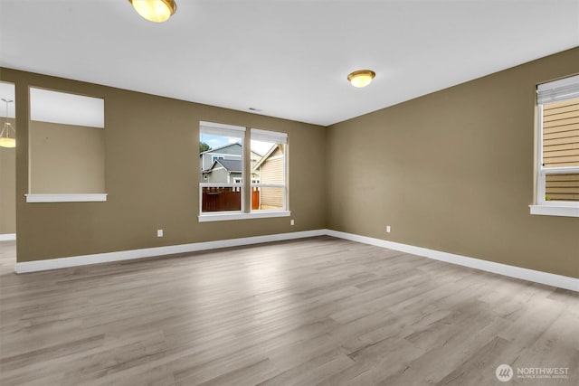18527 97th Ave E, Puyallup, WA 98375 - empty room with wood finished floors and baseboards