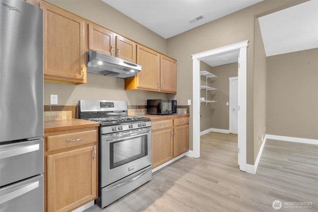 18527 97th Ave E, Puyallup, WA 98375 - kitchen featuring appliances with stainless steel finishes, under cabinet range hood, light countertops, light brown cabinetry, and light wood-style floors