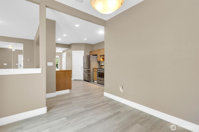 18527 97th Ave E, Puyallup, WA 98375 - unfurnished living room with light wood-type flooring and recessed lighting