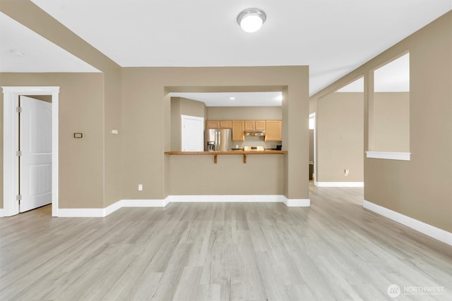 18527 97th Ave E, Puyallup, WA 98375 - unfurnished living room featuring light wood-style floors