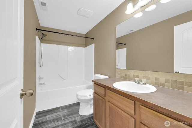 18527 97th Ave E, Puyallup, WA 98375 - bathroom featuring vanity, backsplash, and  shower combination