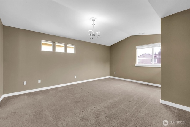 18527 97th Ave E, Puyallup, WA 98375 - carpeted spare room featuring lofted ceiling, a chandelier, and healthy amount of natural light