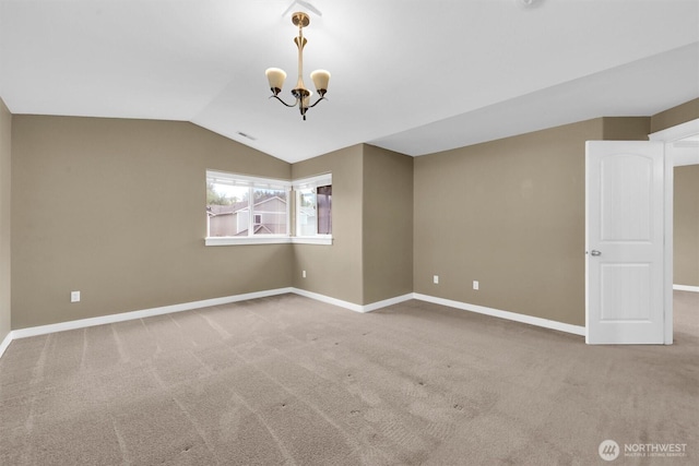 18527 97th Ave E, Puyallup, WA 98375 - spare room featuring carpet, a chandelier, and vaulted ceiling