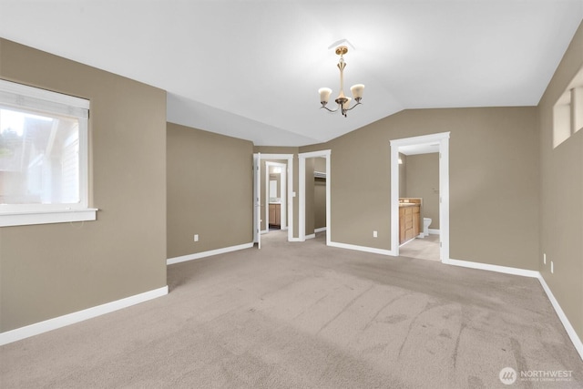 18527 97th Ave E, Puyallup, WA 98375 - unfurnished bedroom with lofted ceiling, carpet flooring, a chandelier, a walk in closet, and ensuite bath