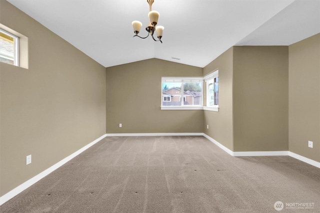 18527 97th Ave E, Puyallup, WA 98375 - carpeted empty room with a chandelier and lofted ceiling