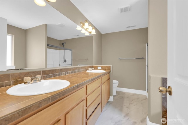 18527 97th Ave E, Puyallup, WA 98375 - full bath with a shower with door, double vanity, and marble finish floors