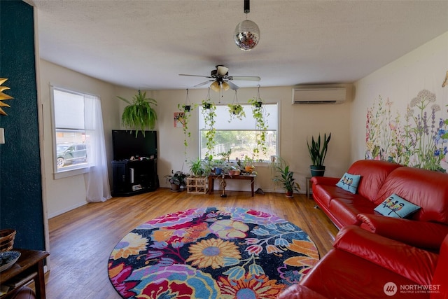 1328 Grant St, Walla Walla, WA 99362 - living area with ceiling fan, an AC wall unit, and wood finished floors