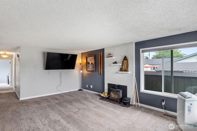 1401 Lum Rd, Centralia, WA 98531 - carpeted living room featuring a wood stove and a textured ceiling
