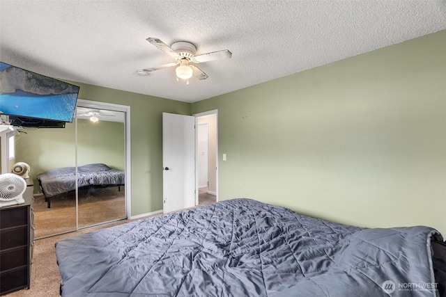 1401 Lum Rd, Centralia, WA 98531 - carpeted bedroom featuring a textured ceiling, ceiling fan, and a closet