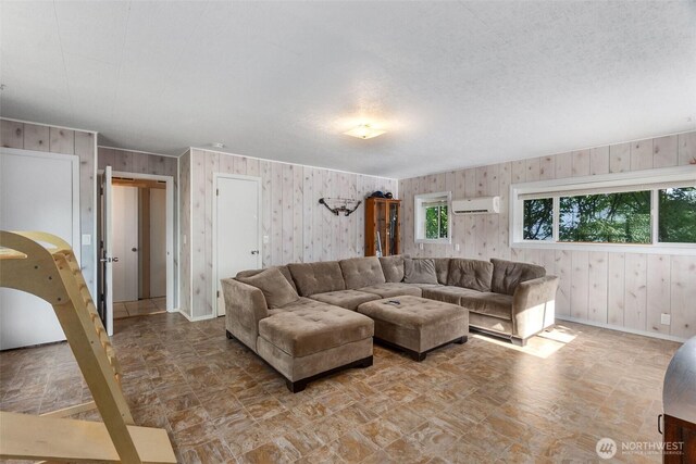 1401 Lum Rd, Centralia, WA 98531 - living room featuring wood walls and a wall mounted air conditioner